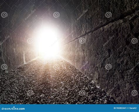 Glowing Light at the End of the Tunnel. Concept, Metaphor. Stock Image ...