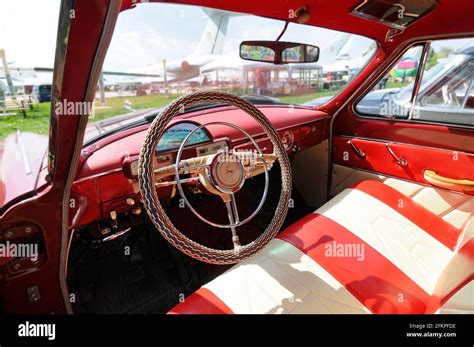 Interior of an old car GAZ Volga, made in USSR: steering wheel, dashboard, glove compartment ...