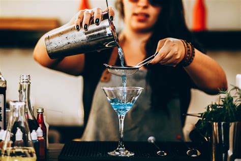 Photo of Woman Pouring Liquid From Drink Mixer · Free Stock Photo