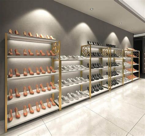 a large display case filled with lots of pairs of shoes in front of a wall