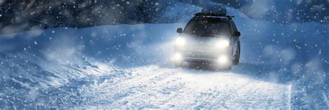 Download Winter Driving in Snowy Mountain Road Wallpaper | Wallpapers.com