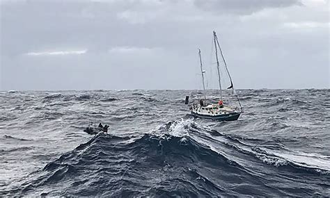 Couple rescued after yacht capsizes in 'waves the size of buildings' off Australian coast