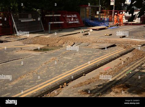 Hot weather causes a major road in Kingston upon Thames to crack and ...