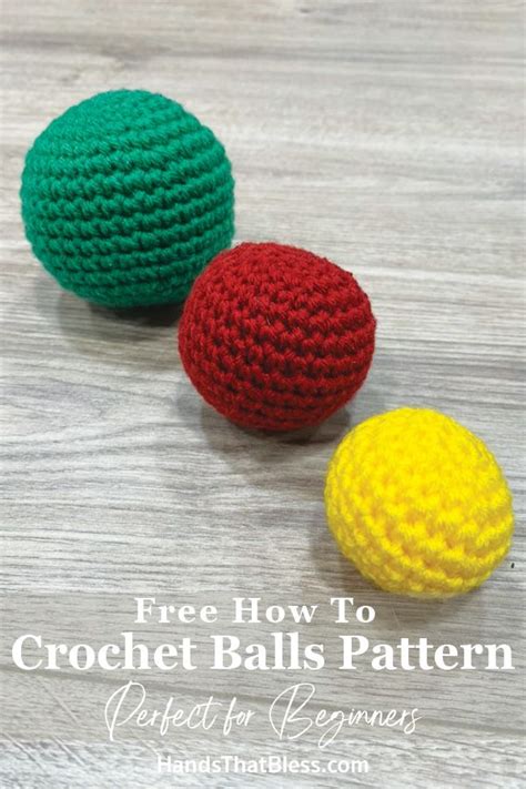 three crochet balls sitting on top of a wooden table next to each other