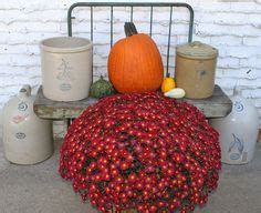 Crock with some flowers. | Yard art, Vintage farm, Flowers