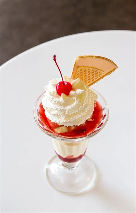 Ice Cream With Cherry And Whipped Cream Stock Photo - Image: 48870496