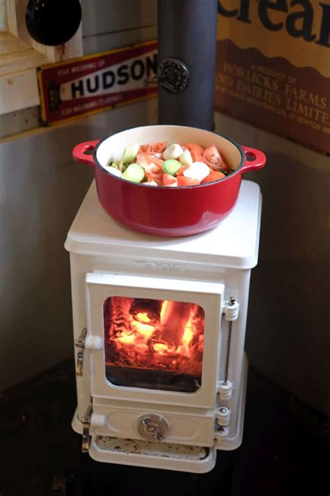 Turn your tiny wood stove into a tiny cookstove with a cast iron cook pot.