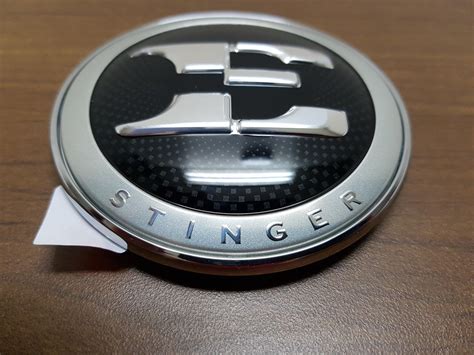 OEM Kia Stinger E Badge Hood Emblem - Kia Stinger dot com