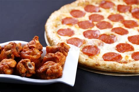 Pepperoni Pizza With Chicken Wings Stock Photo - Image: 11987220