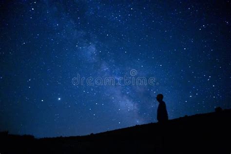 Magical View of a Silhouette of a Man Stargazing the Milky Way and the ...