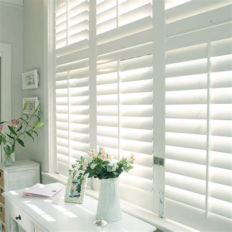 Premier White Real Wood Window Shutters | Blinds for windows living rooms, White shutters living ...