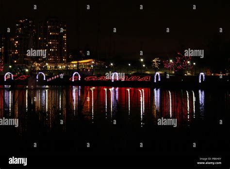 Christmas lights around a lake Stock Photo - Alamy