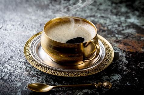 Premium Photo | Coffee in a cup and saucer on an old.