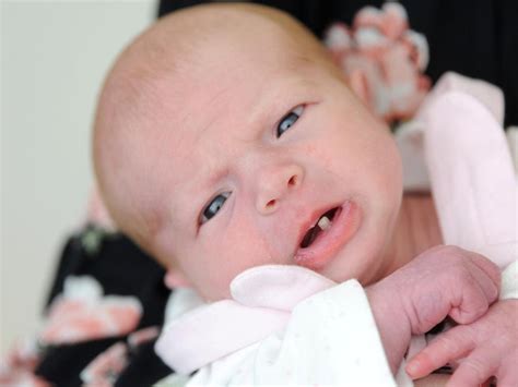 New mum stunned after baby girl is born with fully-grown tooth | The Courier-Mail