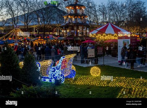 Seattle Christmas Market scene with the Christmas Pyramid, Santa s sleigh, holiday lights, and ...