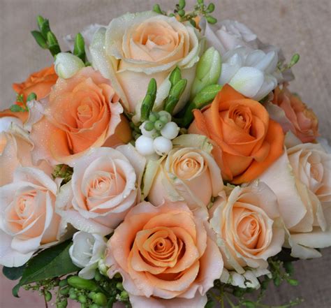 Peach apricot white roses and green hypericum berries | Rose wedding ...