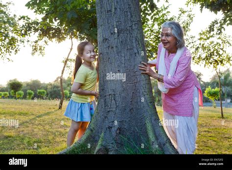 Grandmother and granddaughter playing hide and seek Stock Photo - Alamy