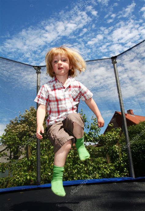 Child jumping trampoline — Stock Photo © tlorna #5464569