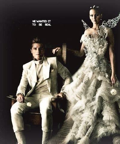 Peeta and Katniss in their wedding outfits that were worn to the interviews instead of their ...