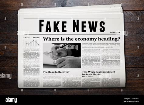 A newspaper showing 'Fake News' as headline Stock Photo - Alamy