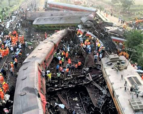 Rescuers try to raise buried coach at triple rail crash site as death ...