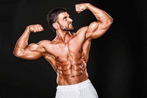 Best Macho Flexing Muscles Bicep Men Stock Photos, Pictures & Royalty-Free Images - iStock