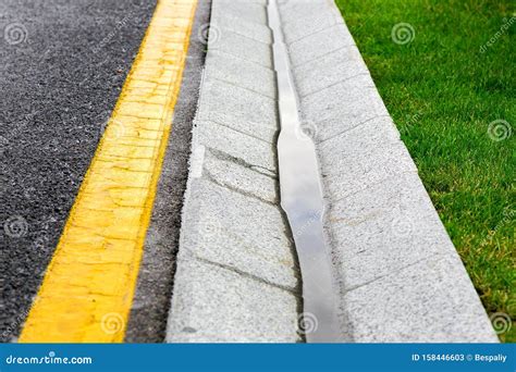 Storm Water Channel Concrete Gutter with Rain Water. Stock Image - Image of asphalt, rain: 158446603