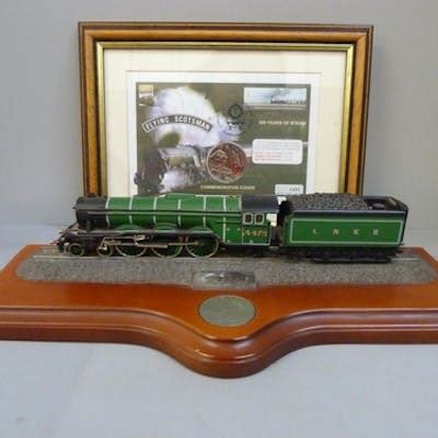 A commemorative Flying Scotsman coin cover and model on wood... | Barnebys