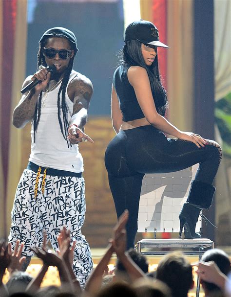 Nicki Minaj Gets Lil Wayne A Pink Neon Sign / Young Money