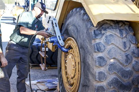 Industrial Tire Installation on Cat Scraper - Complete Step by Step Install