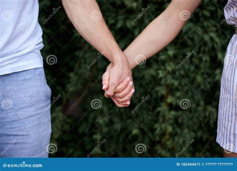 Arms of Young Couple in Love, Embracing. Close-up Picture of Romantic ...