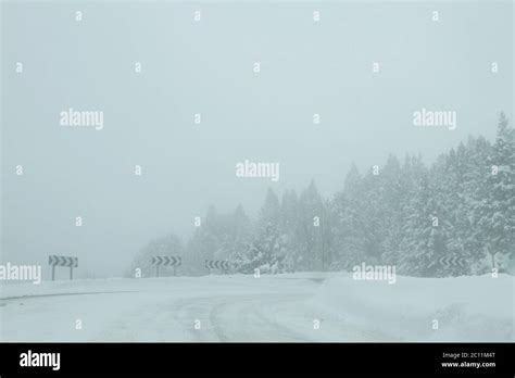 Mountain road in winter with snow Stock Photo - Alamy