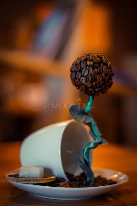 A Sculpture of Coffee Bean Drinking a Cup of Coffee. Editorial Photography - Image of sight ...