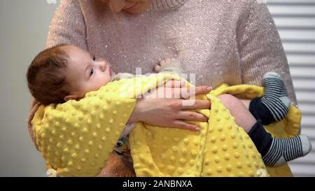 Mother singing a lullaby to her baby son Stock Photo - Alamy