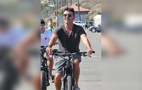 Simon Cowell Goes Bike Riding With His Family