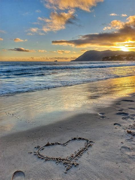 Heart Drawn in the Sand at Sunset