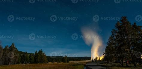 Eruption of Old Faithful geyser at Yellowstone National Park at night ...