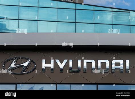 Hyundai brand logo on car dealership company. Hyundai is a South Korean ...