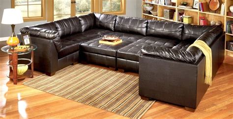 plush u shaped black leather sectional couch with double ottoman as sleeper at day | Sofa bed ...