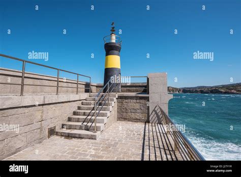 Lighthouse in Comillas port, Cantabria, Spain Stock Photo - Alamy