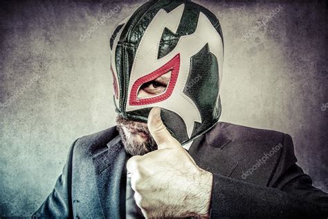 Businessman with mexican wrestler mask — Stock Photo © outsiderzone #53897801