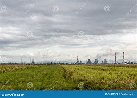 Green Field in Front of Industrial Oil Plant Stock Image - Image of ...