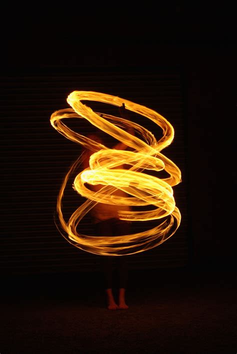 Model with fire poi. Slow shutter speed. Elements. Light. Liquid. Heat ...