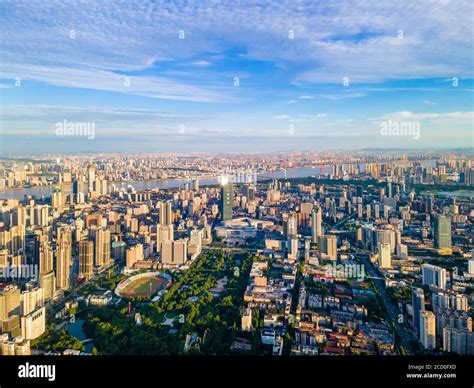 Aerial view of Wuhan skyline and Yangtze river with supertall skyscraper under construction in ...