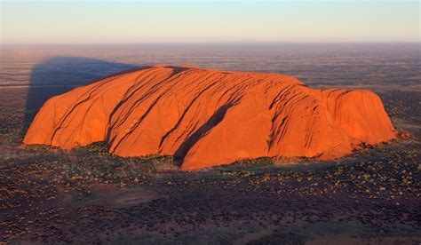 Uluru a large sandstone rock formation in the southern part of the Northern Territory central ...