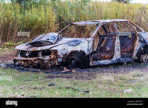 A burnt-out car. Car old burned by fire. Fire burned car Stock Photo ...