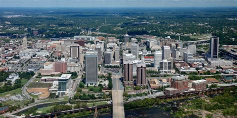 an aerial view of a city with tall buildings and bridges in the ...