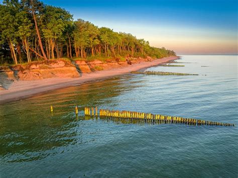 Premium Photo | Beach at sunrise on baltic sea in poland