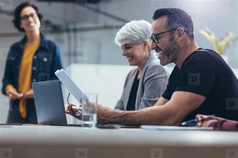 Happy business people in a meeting stock photo (199391) - YouWorkForThem