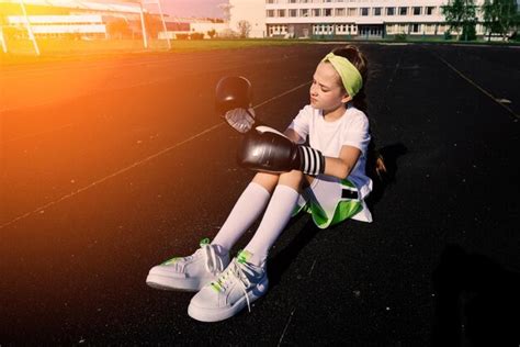 Premium Photo | Female child boxer in gloves feminism concept back to school physical training ...